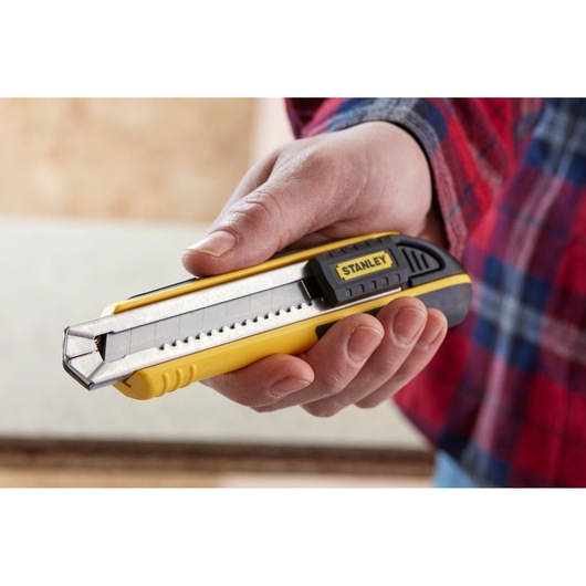 STANLEY 0-10-481 utility knife with segmented blade held in hand, yellow and black design.