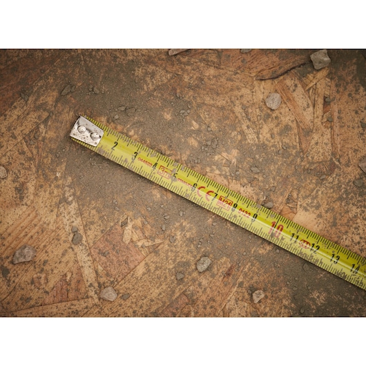 STANLEY 0-33-238 tape measure photography on dusty plywood with visible measurement marks.
