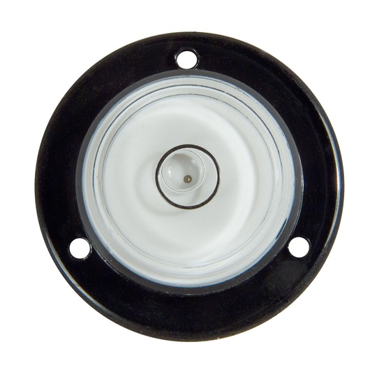 Round Stanley spirit level with three mounting holes, viewed from above, used for photography alignment.