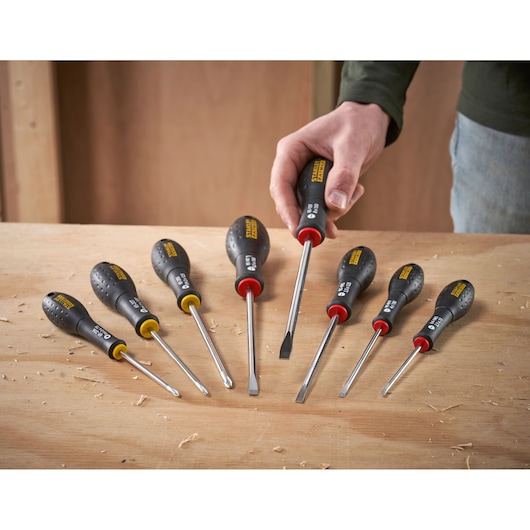 STANLEY 0-65-437 screwdriver set with black handles and colored collars on a wooden surface.