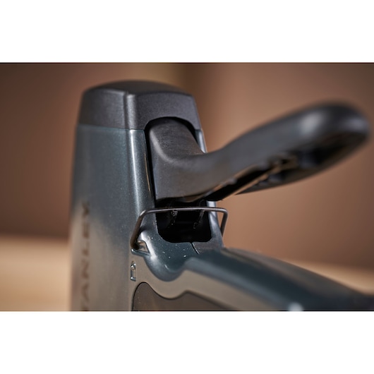 Close-up photo of STANLEY 0-TR250 staple gun handle, showing ergonomic design and trigger mechanism.