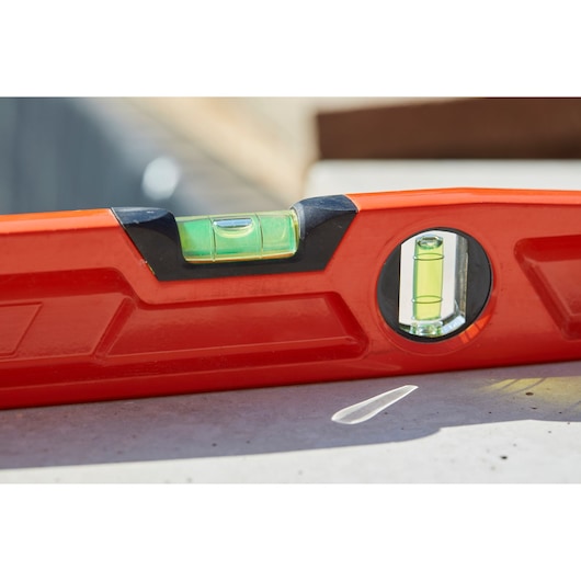STANLEY 1-42-314 red spirit level close-up, showing vial details, photography outdoors.