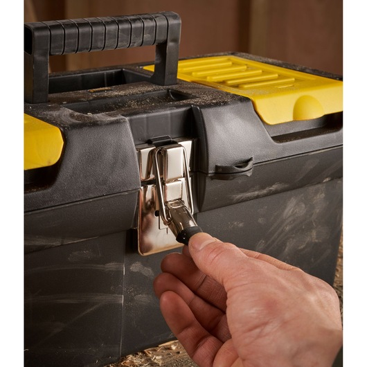 STANLEY 1-92-065 toolbox with black handle and yellow lid, hand opening metal latch, front angle photo.