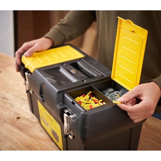 STANLEY 1-92-066 black toolbox with yellow lid compartments on workbench, photography rear angle.