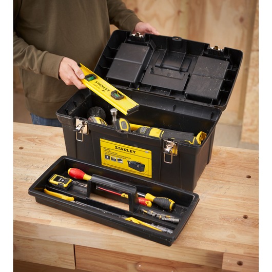 STANLEY 1-92-066 toolbox in photography, open showing assorted hand tools on a wooden workbench.