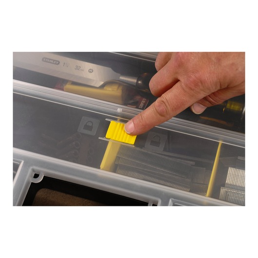 STANLEY 1-92-762 organizer close-up, finger sliding yellow latch on transparent lid.