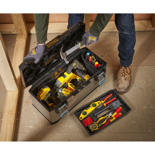 STANLEY 1-95-616 toolbox opened with tools and power drills, workshop setting, top angle photography.