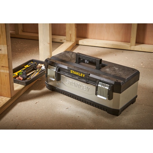 STANLEY 1-95-619 toolbox with tray and tools on workshop floor, silver and black design.
