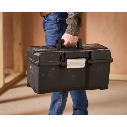 Photo of STANLEY 1-97-510 toolbox being carried by a person indoors.