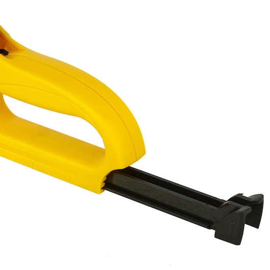 STANLEY 6-TR35 yellow hand stapler side angle on white background.