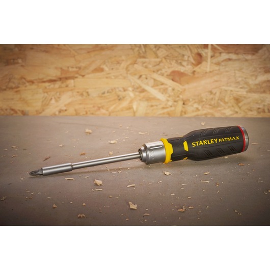 STANLEY FMHT0-62690 FATMAX screwdriver with black and yellow handle on workshop surface.