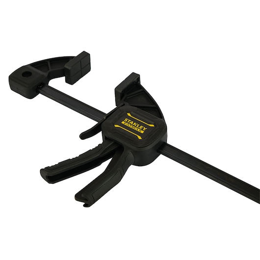 STANLEY FMHT0-83233 black trigger clamp, side angle, yellow logo, on white background.