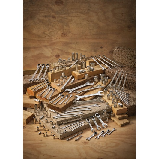STANLEY FMMT13034-0 hand tools set with assorted wrenches and sockets photographed on a wooden display.