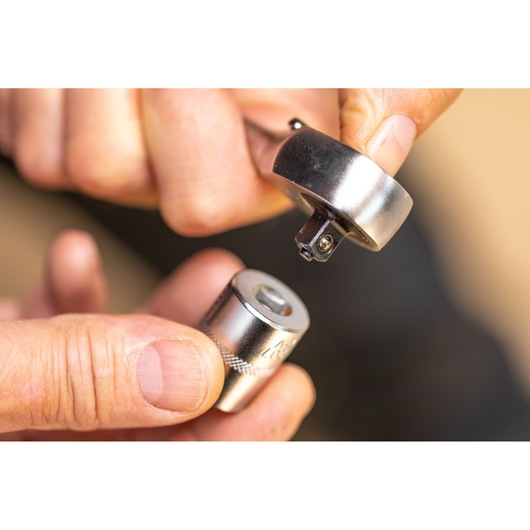 STANLEY FMMT17185-0 ratchet and socket close-up, hands attaching socket, photography.