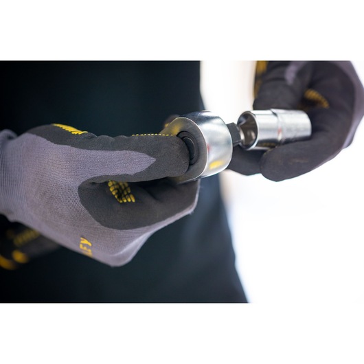 STANLEY FMMT17236-0 socket tool held in gloved hands, close-up view, photography product category.