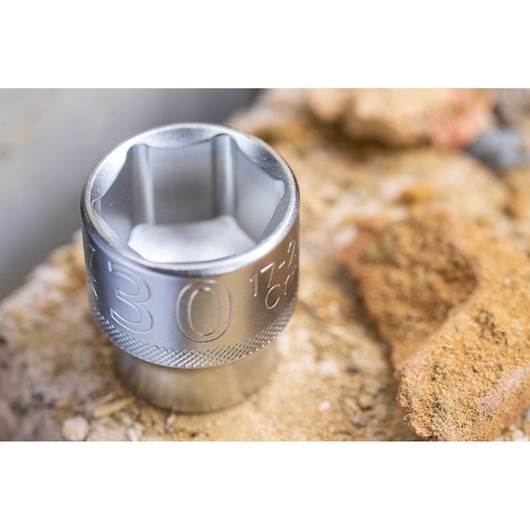 STANLEY FMMT17247-0 socket tool, chrome finish, close-up on rough surface, photography