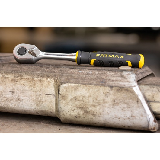 Photo of STANLEY FMMT82680-0 ratchet with black and yellow FATMAX handle on a metal surface.