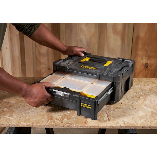 STANLEY FMST1-71968 organizer with transparent compartments, shown with a drawer open on a workbench.