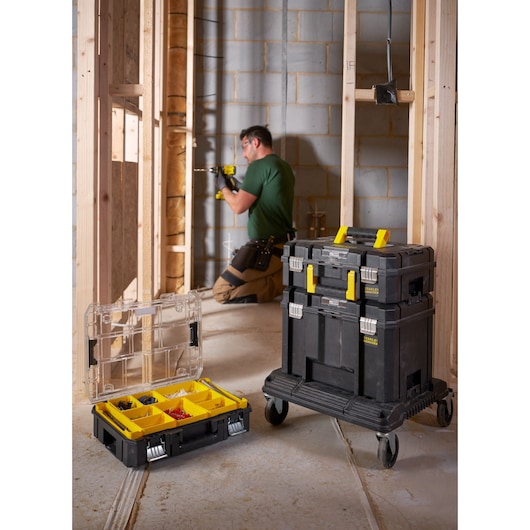 STANLEY FMST1-71972 rolling tool storage and organizer box set in jobsite setting, yellow and black.
