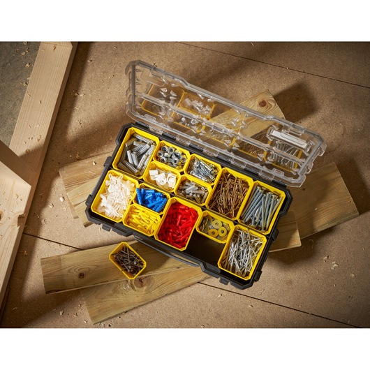 STANLEY FMST1-75779 organizer box with yellow compartments filled with assorted fasteners, top view.