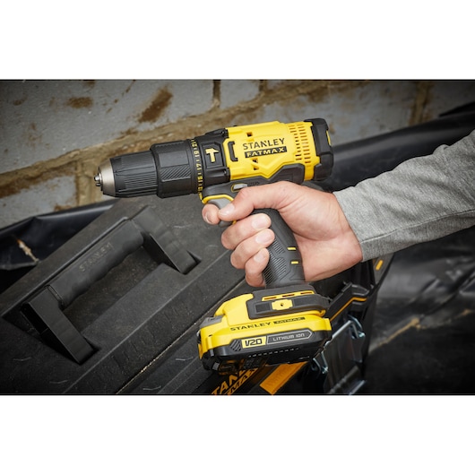 STANLEY SFMCD711C2K cordless drill with yellow and black design, FATMAX branding, handheld side angle.