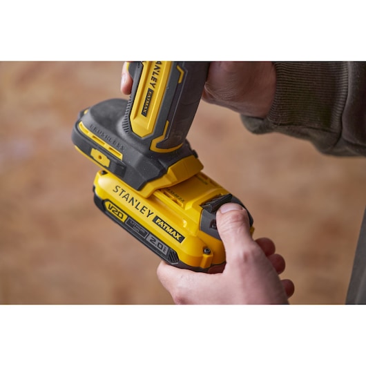 Photo of STANLEY SFMCE510B brushless V20 FATMAX cordless tool held in hand, close-up angle.