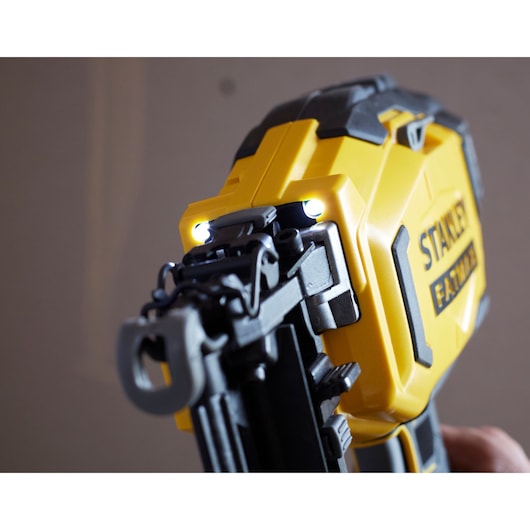 STANLEY SFMCN616D2K yellow cordless nailer with LED lights, close-up angle.