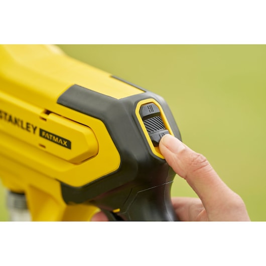 Photo of STANLEY SFMCPC93B photography tool showing close-up yellow control switch.
