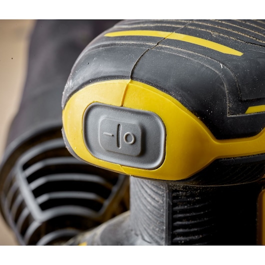 STANLEY SFMCW220D1S cordless sander close-up showing power switch and yellow-black design.