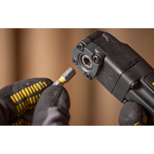 STANLEY STA88582 power tool close-up photography showing bit attachment in gloved hand.