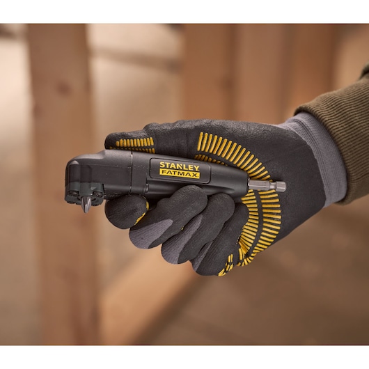 Photo of STANLEY STA88582 FATMAX angle screwdriver held in gloved hand, black and yellow tool.