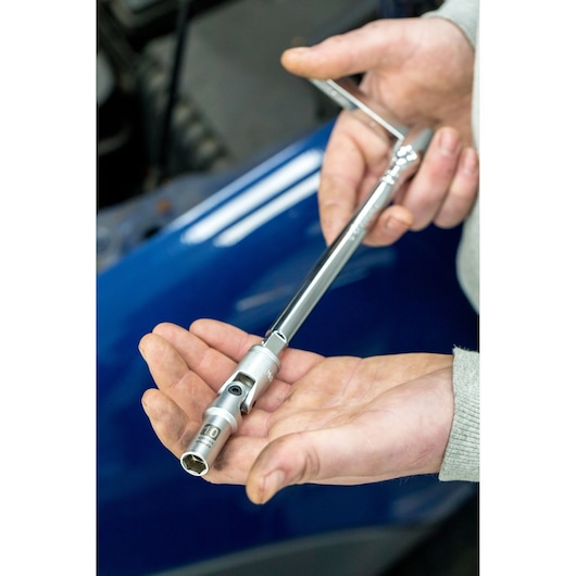 STANLEY STHT80872-0 socket wrench in hand, close-up, chrome finish, automotive tool photography.