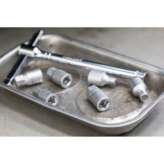 STANLEY STHT81578-0 socket set and wrench on a metal tray, silver finish, product photography.