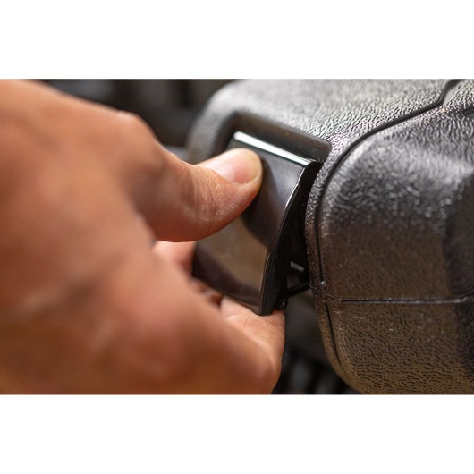 Close-up photo of hand pressing latch on STANLEY STMT82828-1 photography case.