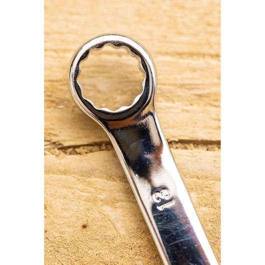 STANLEY STMT82842-0 box-end wrench close-up photography on wood surface.