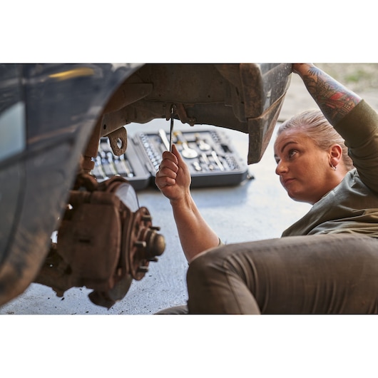 Photo of STANLEY STMT82843-0 12-piece combination wrench set in use during car repair.