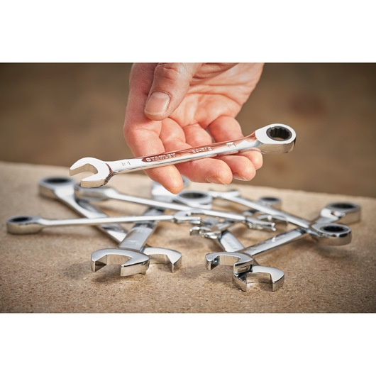 STANLEY STMT89913-0 ratcheting wrench set held in hand, silver finish, photography of product close-up.