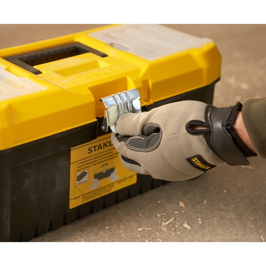 Stanley STST75785-1 toolbox, yellow and black, front angle, glove hand opening latch.