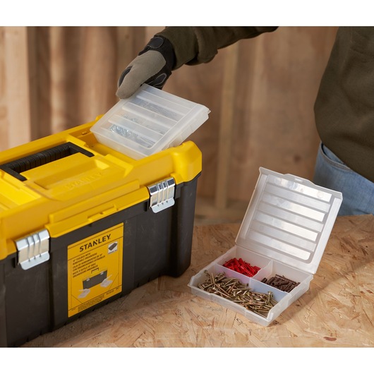 STANLEY STST75787-1 toolbox with removable organizer tray, yellow and black, shown in workshop setting.