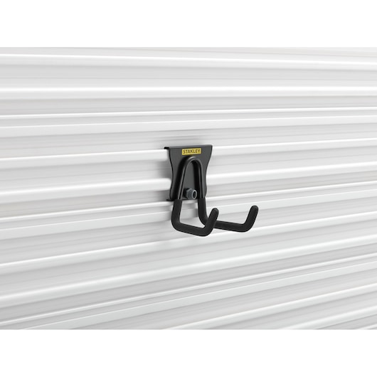 Photo of STANLEY STST82607-1 black wall-mounted utility hook on white panel, side angle.
