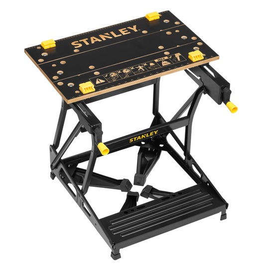 Photo of STANLEY STST83400-1 folding workbench with black and yellow details, angled view on white background.
